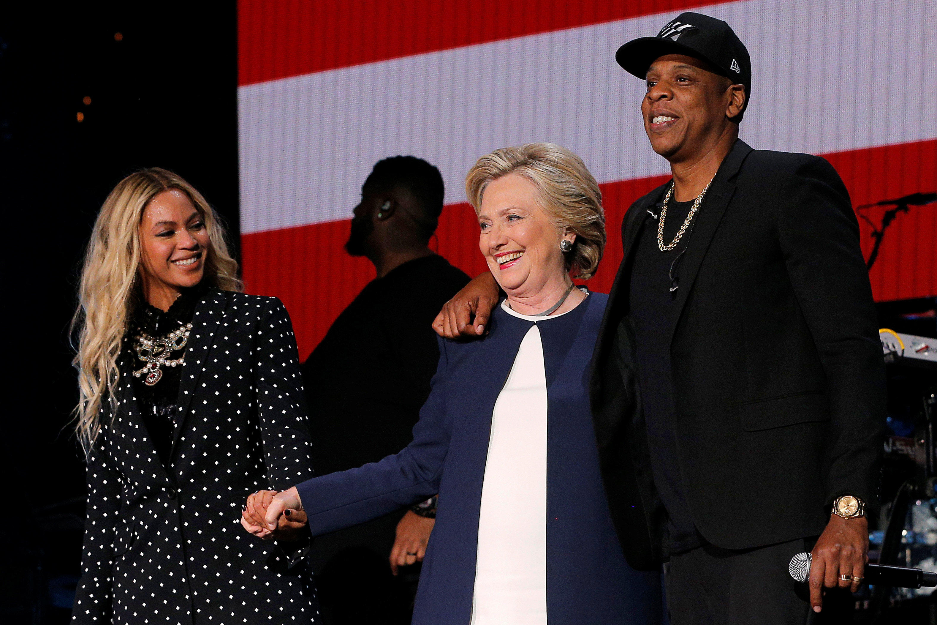 U.S. Democratic presidential nominee Hillary Clinton joins Jay Z and Beyonce onstage at a campaign concert in Cleveland
